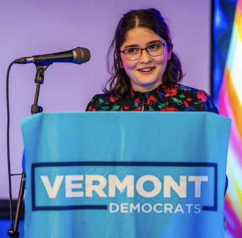 Young woman at podium speaking