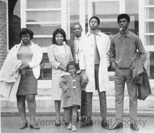 Black and white photo of colored people of various ages