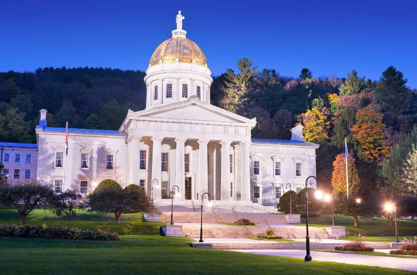 State of Vermont house in evening light with gold dome shining