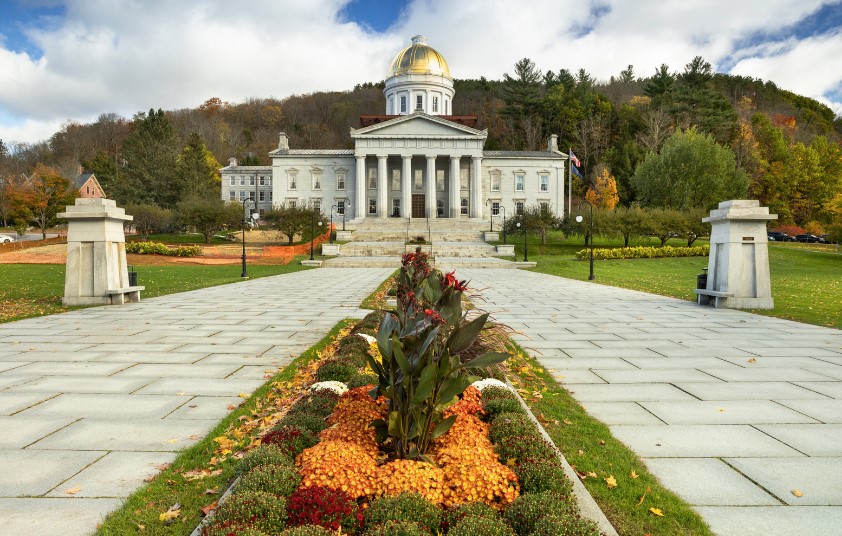 State of Vermont house in evening light with gold dome shining